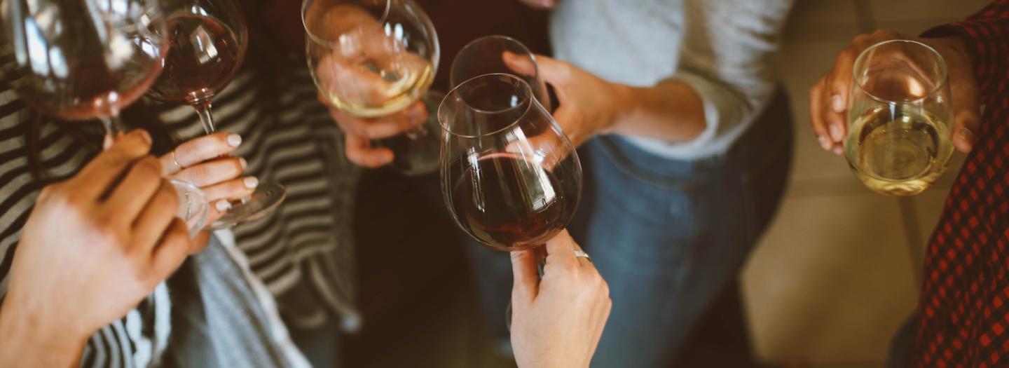 A group gathered with drinks for a cheer