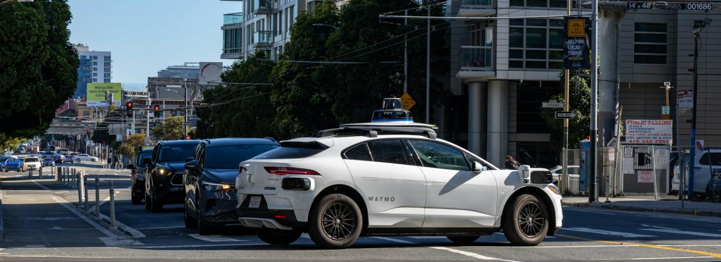 Waymo vehicle in a busy intersection